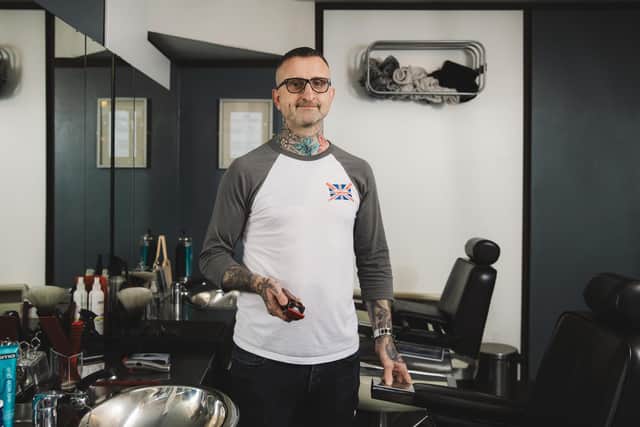James Shane in his barber shop.