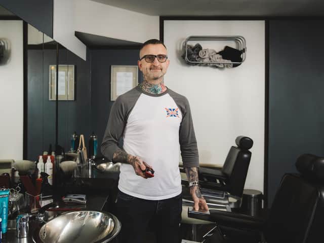 James Shane in his barber shop.