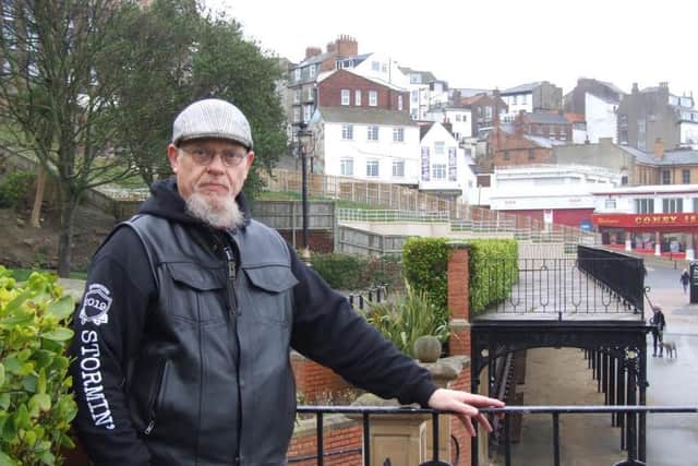 Local history buff and biker Phil Hibbard has succeeded in winning listed status for the popular Scarborough seafront seating shelter.