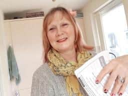 Kaye Wardman-Seal with a Hunmanby Support Group leaflet