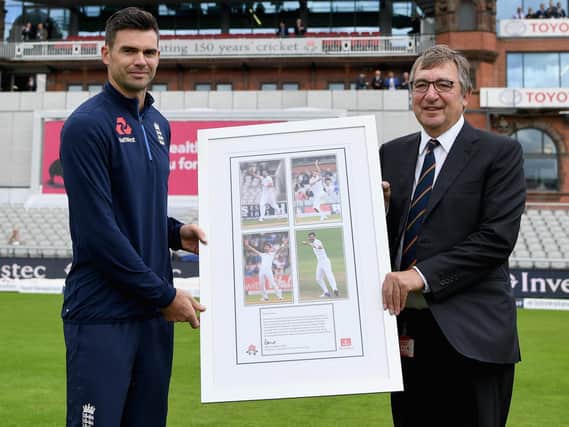 David Hodgkiss, Chairman of Lancashire CCC, presents James Anderson of England with a framed photo after the naming of the James Anderson End during Day One of the 4th Investec Test between England and South Africa at Old Trafford on August 4, 2017