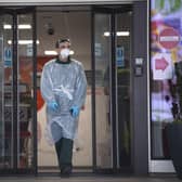 An ambulance staff member wearing PPE at St Thomas' Hospital in London yesterday. Picture: Victoria Jones/PA