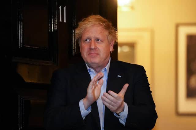 Prime Minister Boris Johnson clapping outside 11 Downing Street in London to salute local heroes during Thursday's nationwide Clap for Carers NHS initiative to applaud NHS workers fighting the coronavirus pandemic. Photo: PA