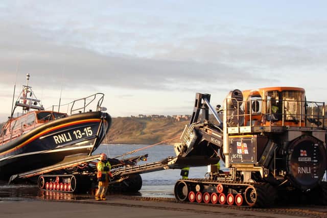 The lifeboat launches to rescue fishing boat