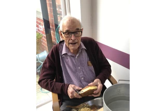 Mucking in - Pip Furse peeling potatoes