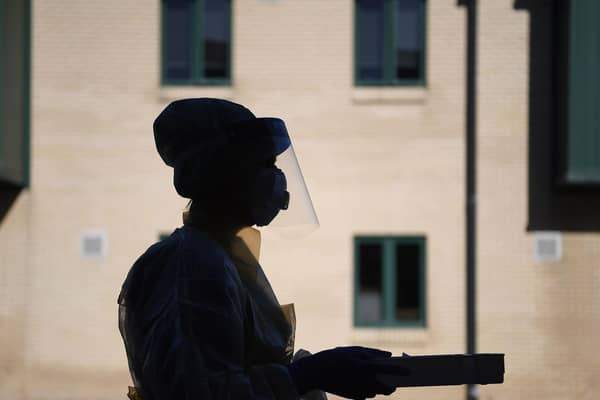 A nurse treating coronavirus patients (photo: Michael Cooper/PA Wire).