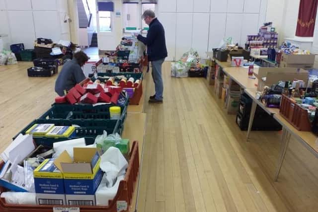 Sorting through supplies at The Rainbow Centre.