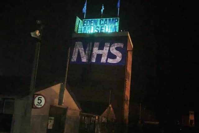 The water tower at Eden Camp illuminated.