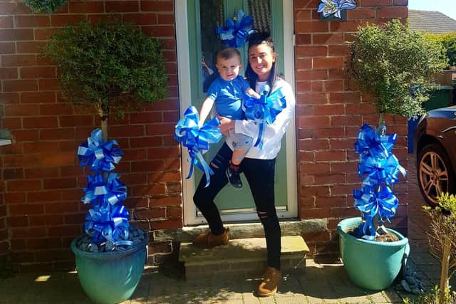 Michelle Brown from Flowers of Distinction with her son Eddie.