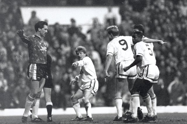 FA Cup 4th round replay action from Elland Road. United's players claim Chris Whyte's goal should stand. Ref Alan Seville thinks otherwise while David Seaman just wants to get on with the game.