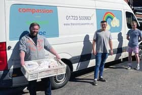 Hideout Manager Jordan Padgham and representatives of the Rainbow Centre with some of the Cooplands food parcels.