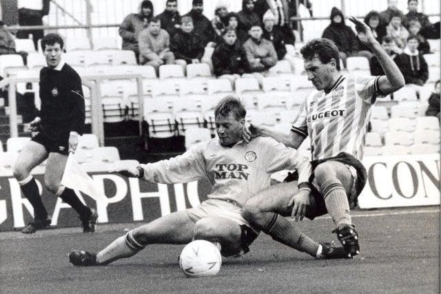 Action from Highfield Road as David Batty battles with Sky Blues player-manager Terry Butcher.