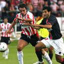 Boro boss Darren Kelly, left, in action for Derry City against PSG