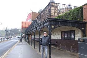 Local history buff and biker Phil Hibbard has succeeded in winning listed status for a popular Scarborough seafront seating shelter.