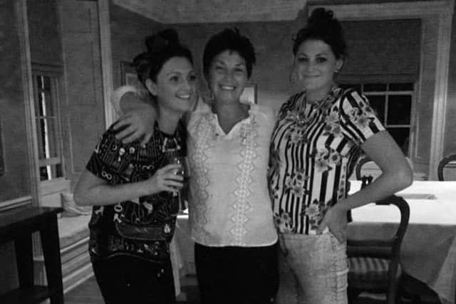 Helen, centre, with her daughters Megan, left and Jenna, right.