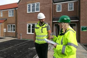 Beyond Housing staff are pictured at one of its developments.