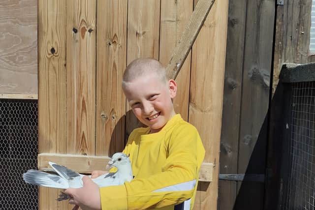 Charlie with Isobel, one of his pigeons