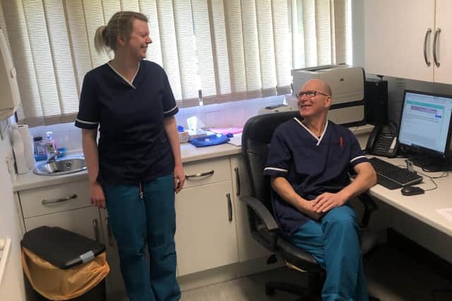 Dr Anna Black and Dr Mike Shepherd wearing scrubs produced by Carol Gregory