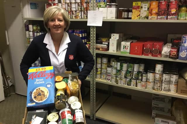 Salvation Army Scarborough Corps Captain Angela Noble with some of the food donations.