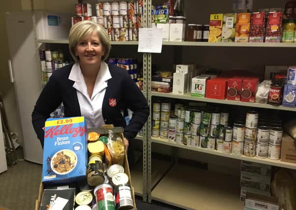 Salvation Army Scarborough Corps Captain Angela Noble with some of the food donations.