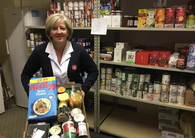 Salvation Army Scarborough Corps Captain Angela Noble with some of the food donations.
