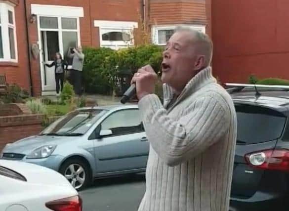 Ross Cole singing in Woodall Avenue.