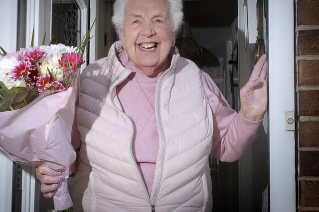 Phyllis Watson with flowers