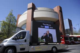 Captain Tom Moore pictured on an electronic board outside the Harrogate Nightingale Hospital.