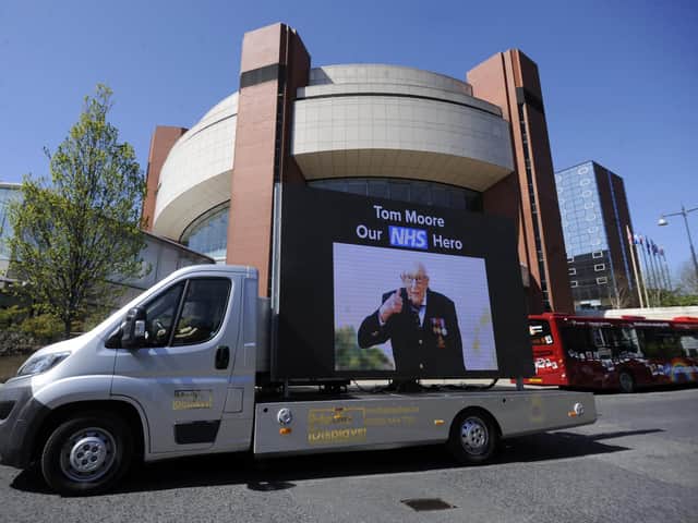 Captain Tom Moore pictured on an electronic board outside the Harrogate Nightingale Hospital.