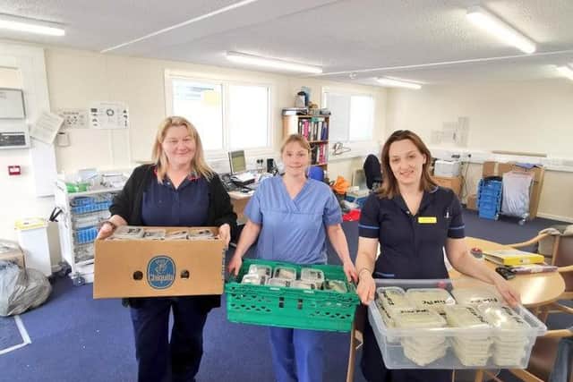 Staff receive a delivery. Picture: Rob Clark