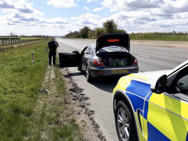 Police officers stop the car near Scotch Corner.
