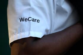 Shirt of a police officer reading WeCare.