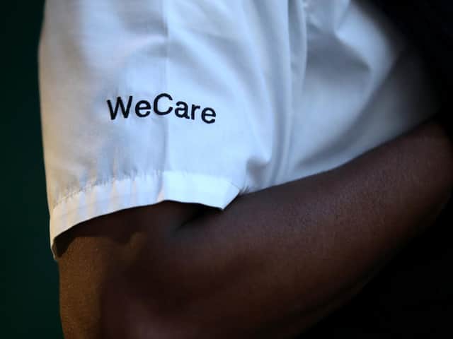 Shirt of a police officer reading WeCare.