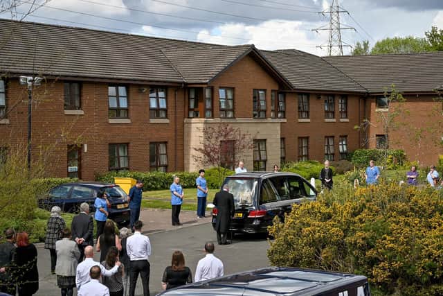 A hearse carries a former care home resident to their funeral in Paisley, Scotland, earlier this week. Photo: Jeff J Mitchell/Getty Images
