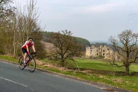 A lone cyclist rides past Barden Tower on Good Friday during the coronavirus lockdown.