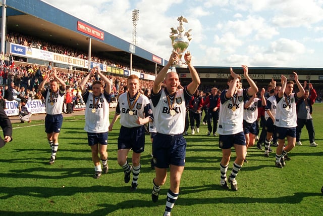 PNE players parade the Third Division title after beating Exeter City on the final day of the 1995/96 season