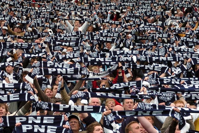 Preston fans in the Alan Kelly Town End hold their scarves aloft before playing Birmingham on the final day of the 2006/07 season