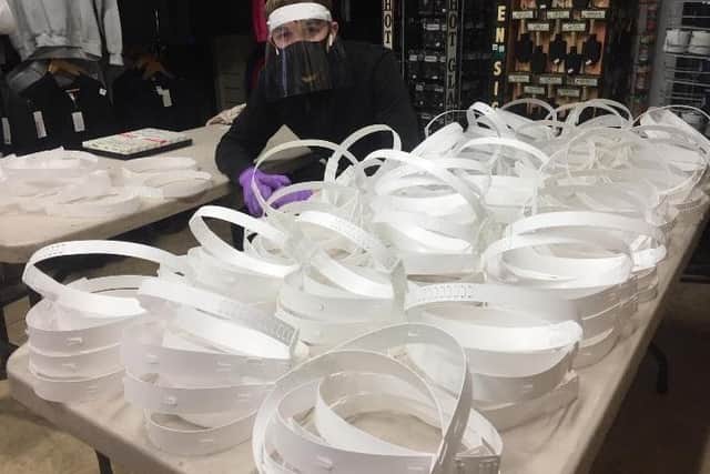 The face shield production line, with Harvey Wallis whos been helping his dad, John.