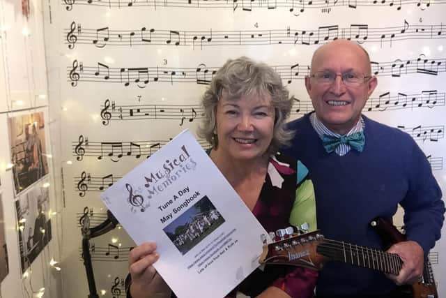 Neil and Ruth Hannah with the Tune a Day Songbook