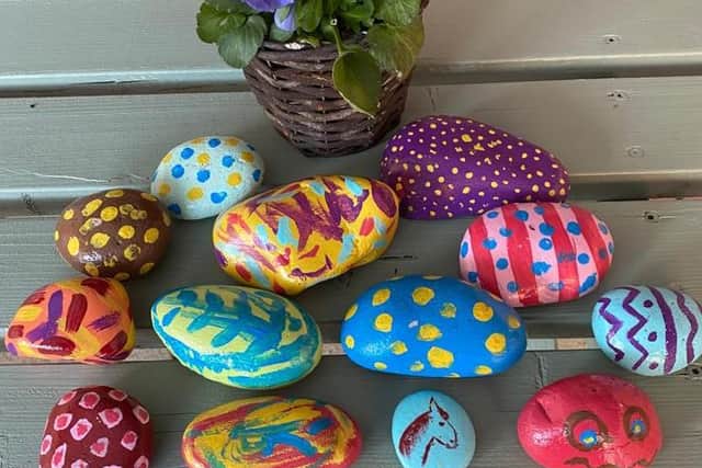 Local children have decorated an array of colourful stones for the garden