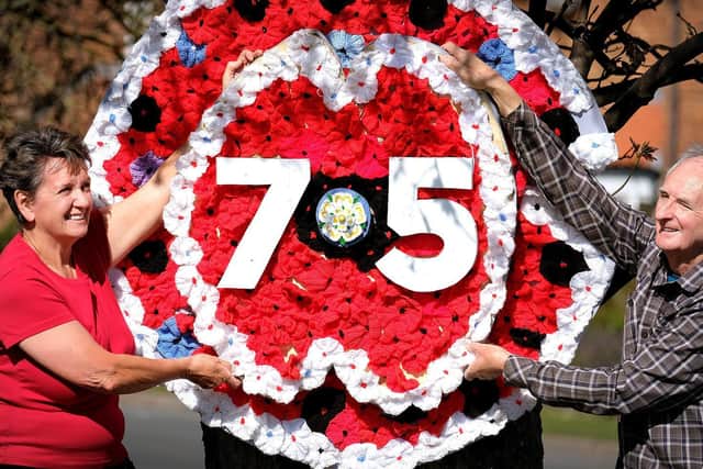 Staxton residents Celia Wilkinson and Alan Jeffels have decorated the area around the war memorial ready for VE Day.