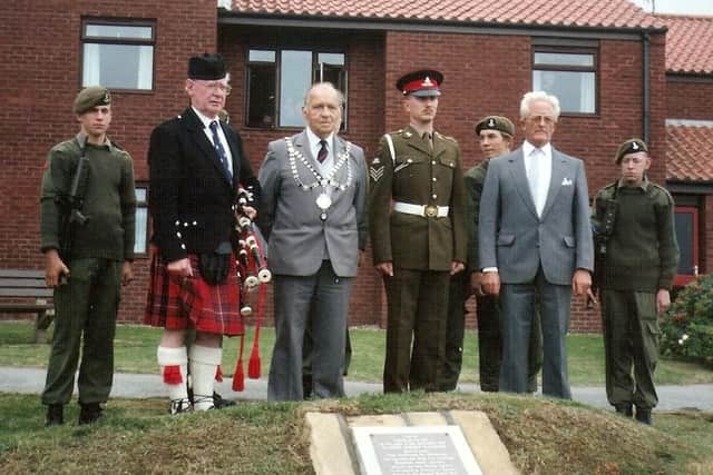 A service at Gunner Robert Watmore’s memorial which can be seen in the adjoining building’s garden at Welton Court, North Promenade.