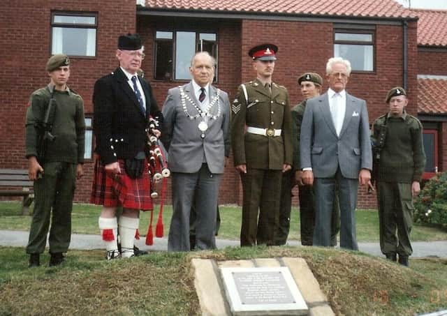 A service at Gunner Robert Watmore’s memorial which can be seen in the adjoining building’s garden at Welton Court, North Promenade.