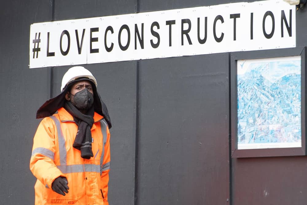 A construction worker wearing a protective face mask at a building site in central London, as Prime Minister Boris Johnson said people who cannot work from home should be "actively encouraged" to return to their jobs. Photo: PA