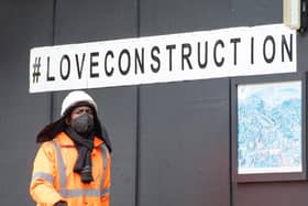 A construction worker wearing a protective face mask at a building site in central London, as Prime Minister Boris Johnson said people who cannot work from home should be "actively encouraged" to return to their jobs. Photo: PA