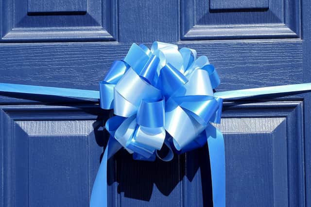 A blue bow on a door. Picture: JPI Media/ Richard Ponter