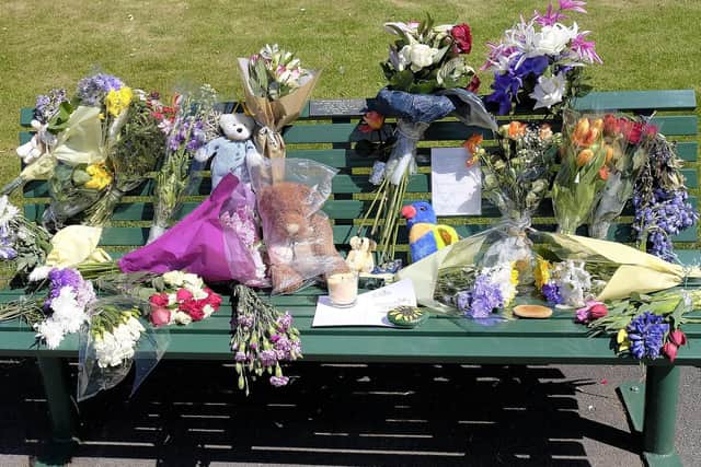 The bench covered in tributes. Picture: JPI Media/ Richard Ponter
