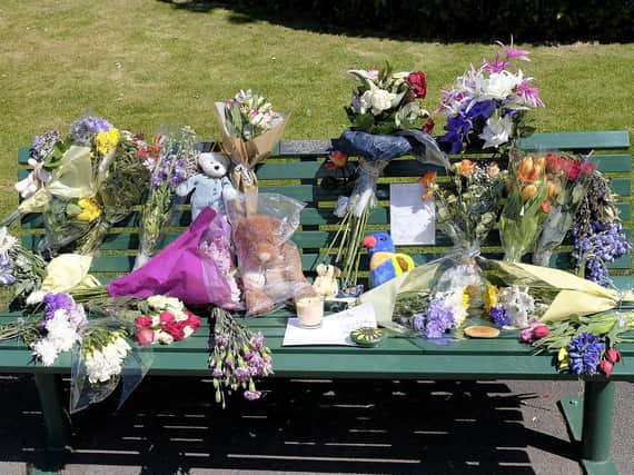 The bench covered in tributes. Picture: JPI Media/ Richard Ponter