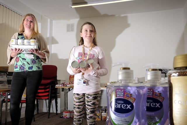 Age UK chief eExecutive Julie Hewitt with daughter Gracie-Mae Bell organising goods to disperse to the community during the pandemic