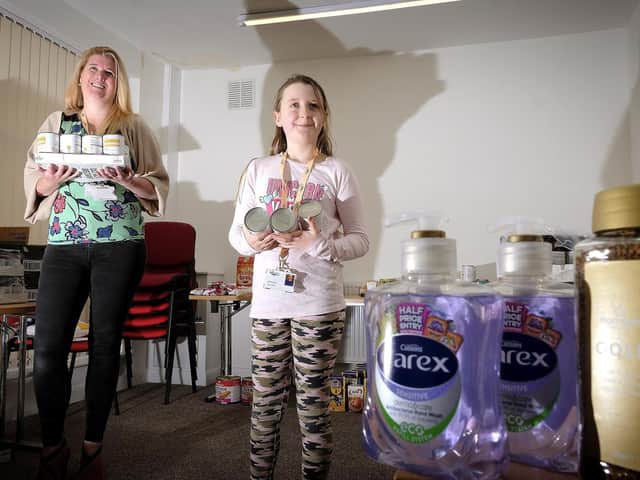 Age UK chief eExecutive Julie Hewitt with daughter Gracie-Mae Bell organising goods to disperse to the community during the pandemic